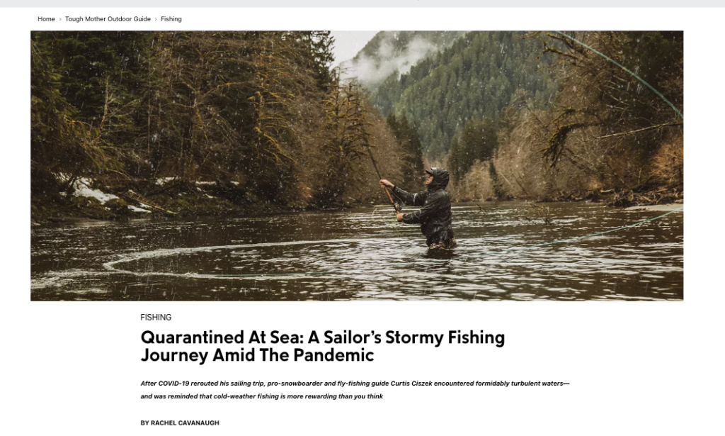 CURTIS CISZEK FLY FISHES ON A RIVER IN THE RAIN.